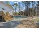 The backyard features a small wooden deck with stairs and newly seeded lawn at 421 Peacock Ln, Summerville, SC 29486