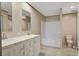 Bathroom featuring double sinks, modern shower, and vinyl flooring at 421 Peacock Ln, Summerville, SC 29486