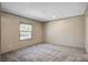 Neutral carpeted bedroom with a view from the window allowing ample natural light at 421 Peacock Ln, Summerville, SC 29486
