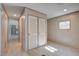 This bedroom features vinyl floors, a window, and double closets at 421 Peacock Ln, Summerville, SC 29486