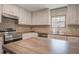 Close-up of the modern kitchen featuring stainless steel appliances and a kitchen island at 421 Peacock Ln, Summerville, SC 29486