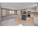 Bright living room and kitchen featuring wood-look flooring and recessed lighting at 421 Peacock Ln, Summerville, SC 29486