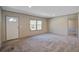 Spacious living room with new carpet, view of the front door, and large window at 421 Peacock Ln, Summerville, SC 29486