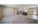 Open-concept living space with carpet, seamlessly connecting to the kitchen area at 421 Peacock Ln, Summerville, SC 29486