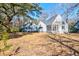 A huge backyard with a screened in back porch area, trees surrounding property at 4333 Cloudmont Dr, Hollywood, SC 29449