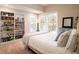 Bright bedroom with a large window, shelving, and a comfortable bed at 4333 Cloudmont Dr, Hollywood, SC 29449