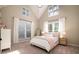 Bright bedroom with vaulted ceiling, large windows, and a cozy, made bed at 4333 Cloudmont Dr, Hollywood, SC 29449
