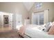 Bedroom with attached closet, view to adjacent room and large bed at 4333 Cloudmont Dr, Hollywood, SC 29449