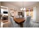 Lovely dining area featuring a rustic wooden table and modern chandelier at 4333 Cloudmont Dr, Hollywood, SC 29449