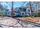 Charming two-story home with a red front door and covered front porch at 4333 Cloudmont Dr, Hollywood, SC 29449