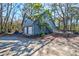 A large two car garage with upper level access and a light blue facade at 4333 Cloudmont Dr, Hollywood, SC 29449