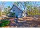 A separate living quarters above the garage with exterior staircase and a light blue facade at 4333 Cloudmont Dr, Hollywood, SC 29449