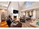 Inviting living room with high ceilings, a fireplace, and large windows at 4333 Cloudmont Dr, Hollywood, SC 29449