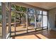 Screened porch with a serene view of the lush backyard and surrounding landscape at 4333 Cloudmont Dr, Hollywood, SC 29449
