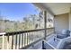Relaxing back porch with lovely pond views and comfortable seating, a great place to relax and unwind at 4610 Palm View Cir, North Charleston, SC 29418
