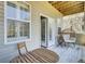 Charming balcony with wood floors and a seating area, perfect for enjoying the outdoors at 4610 Palm View Cir, North Charleston, SC 29418