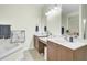 Bright bathroom featuring a large mirror and double sink vanity with plenty of counter space at 4610 Palm View Cir, North Charleston, SC 29418