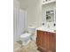 Bright bathroom featuring a toilet, vanity, and a shower with curtain at 4610 Palm View Cir, North Charleston, SC 29418