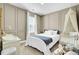 Bedroom with a white crib and bed, neutral paint colors, and paneled walls, creating a peaceful space at 4610 Palm View Cir, North Charleston, SC 29418
