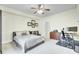 Serene bedroom showcasing neutral tones, a cozy bed, and a workspace area at 4610 Palm View Cir, North Charleston, SC 29418