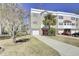 A charming multi-story townhome featuring a driveway and verdant landscaping at 4610 Palm View Cir, North Charleston, SC 29418