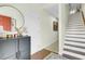 Inviting foyer with hardwood floors, staircase, and stylish decor at 4610 Palm View Cir, North Charleston, SC 29418