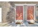 Close-up of front doors with brick facade and 