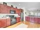 A great kitchen is ready for entertaining, with eat-in bar and stainless steel appliances at 4610 Palm View Cir, North Charleston, SC 29418