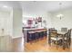 Eat-in kitchen and dining area with a center island and hardwood floors provide a great gathering space at 4610 Palm View Cir, North Charleston, SC 29418