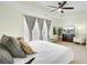 Spacious main bedroom featuring a ceiling fan, a lounge chair, and a dresser with a TV at 4610 Palm View Cir, North Charleston, SC 29418