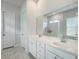 Bathroom showcases a double sink vanity, spacious mirror, and a walk-in shower with white tiling at 500 W Respite Ln, Summerville, SC 29483