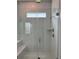 Bathroom boasts a glass-enclosed shower with white subway tile, bench seating, and modern fixtures at 500 W Respite Ln, Summerville, SC 29483