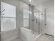 Stylish bathroom features a glass-enclosed shower with bench seating and white subway tile at 500 W Respite Ln, Summerville, SC 29483