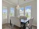 Elegant dining area with a sophisticated chandelier and comfortable upholstered chairs for a welcoming ambiance at 500 W Respite Ln, Summerville, SC 29483