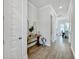 Bright hallway features neutral tones and a decorative table, offering a clean and welcoming first impression at 500 W Respite Ln, Summerville, SC 29483