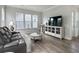 Spacious living room featuring modern furnishings, hard wood floors, and ample natural light at 500 W Respite Ln, Summerville, SC 29483