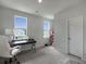 Bright office space with a sleek desk, natural light, and a cozy pet tower at 500 W Respite Ln, Summerville, SC 29483