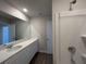 Elegant bathroom showcasing dual sinks, a large mirror, and modern fixtures at 5118 Double Eagle Lp, Summerville, SC 29485
