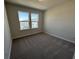 A cozy bedroom illuminated by natural light streaming through two large windows at 5118 Double Eagle Lp, Summerville, SC 29485
