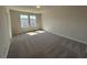 Large bedroom offering natural light, neutral walls and plush carpeting throughout at 5118 Double Eagle Lp, Summerville, SC 29485