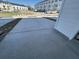 Concrete driveway, leading to a home in a community with pond in background at 5118 Double Eagle Lp, Summerville, SC 29485