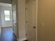 Hallway featuring wood-look floors, neutral paint and white doors at 5118 Double Eagle Lp, Summerville, SC 29485