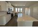 Bright kitchen featuring white cabinets, stainless steel appliances, and an island at 5118 Double Eagle Lp, Summerville, SC 29485