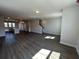 Spacious living room featuring hardwood floors and an open layout into the kitchen at 5118 Double Eagle Lp, Summerville, SC 29485