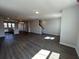 Spacious living room featuring hardwood floors and an open layout into the kitchen at 5118 Double Eagle Lp, Summerville, SC 29485