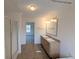 Bathroom featuring double sinks, vanity, shower, and tile floors at 5181 Dr Taylor Rd, Adams Run, SC 29426