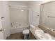 Functional bathroom features a shower-tub combo, vanity with sink, and neutral color palette at 5181 Dr Taylor Rd, Adams Run, SC 29426