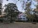 Exterior view of house surrounded by mature trees at 5181 Dr Taylor Rd, Adams Run, SC 29426