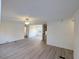 Open-concept living room showcasing light vinyl floors and views of the adjacent kitchen and dining area at 5181 Dr Taylor Rd, Adams Run, SC 29426