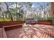 Backyard offers a large deck, built-in seating, fenced perimeter and shed for extra storage at 5429 Roxbury Dr, North Charleston, SC 29418